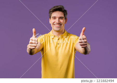 Positive smiling man with hand sign like, thumb up gesture. Happy guy on violet Positive smiling man with hand sign like, thumb up gesture. Happy guy on violet 121882494