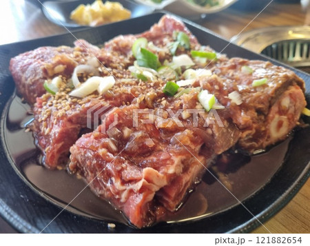 Korean BBQ. Seasoned beef ribs Korean BBQ. Seasoned beef ribs 121882654