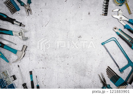 Set of tools on concrete background, 121883901