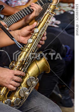 Saxophonist and other instrumentalists 121883925