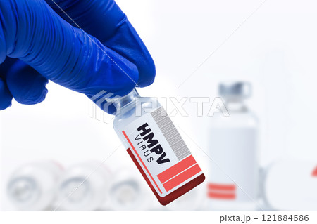 Medical researcher holds HMPV vaccine vial in laboratory setting Medical researcher holds HMPV vaccine vial in laboratory setting 121884686
