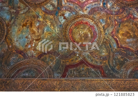Explore the vibrant ceiling art with intricate circular patterns and captivating textures. Ancient ruins of Pompei city, Naples, Italy. 121885823