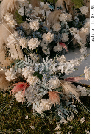 A beautiful bunch of colorful flowers is laying on the ground 121886399