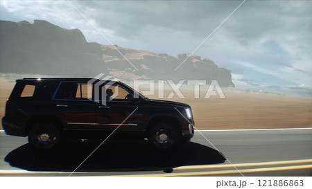 3d model luxury black car on desert highway. Very fast driving. 3d rendering. 3d model luxury black car on desert highway. Very fast driving. 3d rendering. 121886863