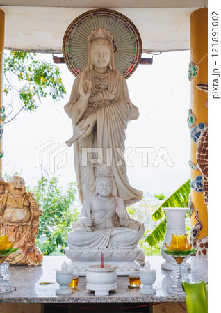 The interior and altar of a Buddhist temple in Asia, Vietnam, at the Long Son pagoda 121891002