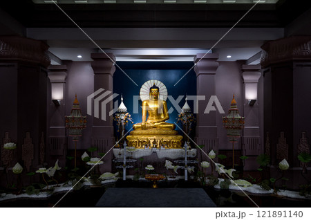 Golden Buddha statue in serene temple setting at Wat Panyanantaram on October 7, 2023 in Phathum Thani, Thailand Golden Buddha statue in serene temple setting at Wat Panyanantaram on October 7, 2023 in Phathum Thani, Thailand 121891140