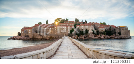 Sveti Stefan island near Budva at sunset light in winter time. Closed resort in Montenegro Sveti Stefan island near Budva at sunset light in winter time. Closed resort in Montenegro 121896332