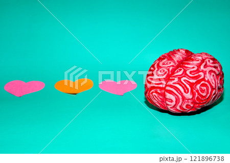 Brain with pink heart on teal Brain with pink heart on teal 121896738