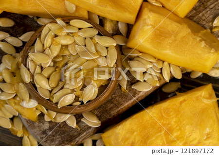wet fresh seeds of ripe orange pumpkin wet fresh seeds of ripe orange pumpkin 121897172