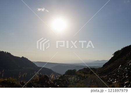 A Stunningly Beautiful Mountain View Under the Bright Sunlight on a Perfect Day Awaits You 121897979