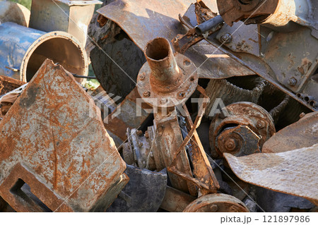 rusty industrial scrap metal pile stacked with discarded materials and debris rusty industrial scrap metal pile stacked with discarded materials and debris 121897986