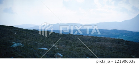 A Beautiful Serene Dusk Illuminates the Rolling Hills and Shimmering Clouds Above 121900038