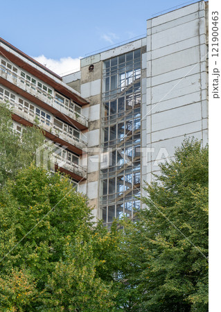 Abandoned sanatorium. Conserved multi-storey building with windows and balconies. Modernism in architecture of the 1960s. Ukraine, Truskavets resort. 121900463