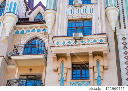 Facade of colorful house. Residential buildings. Bright windows. Balcony modern architecture. 121900525