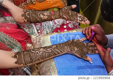 Hands with Henna Tattoo 121900908
