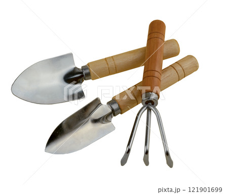 Gardening tools set isolated on white background. Two shovels and a rake for gardening. Herringbone for indoor plants and flowers. Tools with wooden handles. Small shovel. Gardener's tool. 121901699