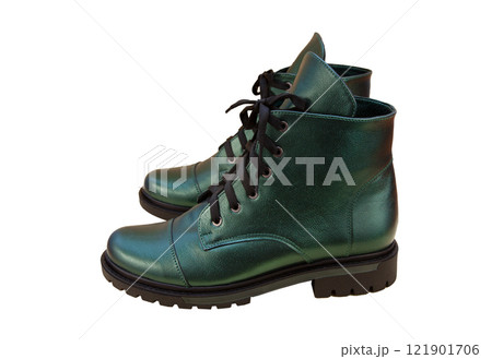 Green leather shoes isolated on white background. Winter and spring off-season boots. Stylish boot. Close-up. Laces, tractor sole. Casual style. Pearlescent fashionable color 121901706