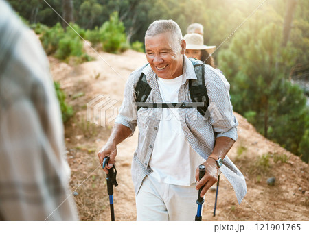 Hike, trekking sticks and senior male walking with friends for fitness and health in nature. Healthy, active and smiling mature man hiking with a backpack. Old group on an outdoor wellness adventure Hike, trekking sticks and senior male walking with friends for fitness and health in nature. Healthy, active and smiling mature man hiking with a backpack. Old group on an outdoor wellness adventure 121901765