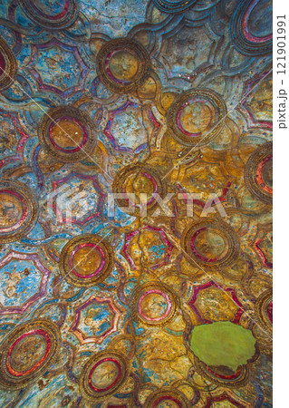 Explore the vibrant ceiling art with intricate circular patterns and captivating textures. Ancient ruins of Pompei city, Naples, Italy. 121901991