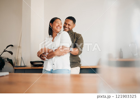 Hugging, romance and playful couple enjoying cuddle, love and bonding while laughing together at home. Loving husband giving affection, care and embrace to his happy, relaxing and funny wife 121903325