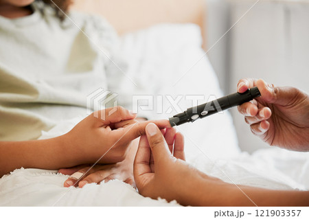 Diabetes, diabetic and mother testing blood sugar levels of a child with a chronic disease at home. Closeup of mom measuring, checking and monitoring glucose in her kid in bed or in the bedroom 121903357
