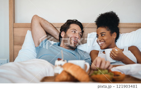 Valentines surprise, birthday or interracial couple celebrate womens day breakfast in bed by a romantic, husband for his wife together. Sweet, in love and loving man serving his lady food and bonding 121903481
