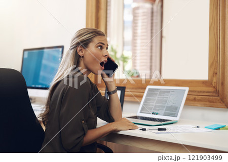 Surprised, shocked and excited young businesswoman gossiping and listening to fake news on a phone call in the office. Amazed female gasping wow in disbelief with an oh my god expression on her face 121903499