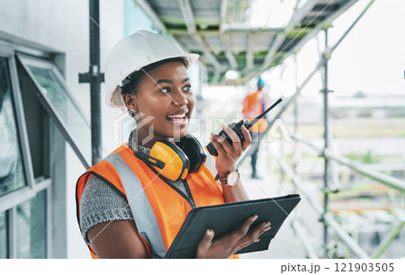 Construction worker with tablet, walkie talkie or radio talking, instructing and checking building progress on development site. Architect manager, female leader or engineer watching infrastructure 121903505