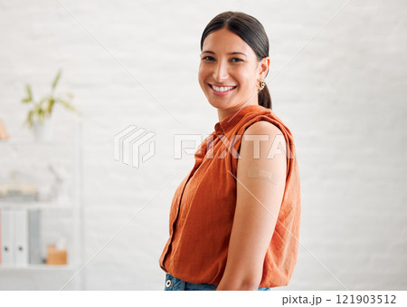 Smiling, happy and motivated female entrepreneur showing great leadership in a creative office with copy space. Portrait of confident and proud entrepreneur satisfied with job in a startup business 121903512