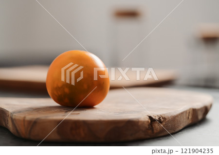 Lulo fruit on olive wood board on kitchen countertop Lulo fruit on olive wood board on kitchen countertop 121904235