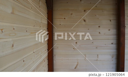 fragment of wooden building made of light textured boards and dark planks, part of a barn or house, texture in country style fragment of wooden building made of light textured boards and dark planks, part of a barn or house, texture in country style 121905064