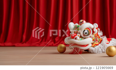 Colorful lion dance headpiece with golden balls on wooden floor. for Chinese New Year 121905669