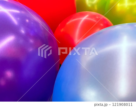 Vibrant Multicolored Balloons Shining in Radiant Light 121908011