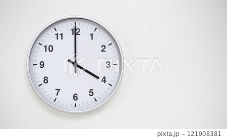 Minimalist White Clock with Silver Frame Striking 16.00/04.00 on White Background. Perfect for Time Management and Corporate Campaigns Minimalist White Clock with Silver Frame Striking 16.00/04.00 on White Background. Perfect for Time Management and Corporate Campaigns 121908381
