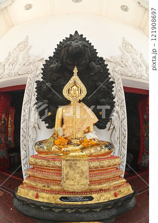 Buddha statue in Naga Prok position placed to decorate the front of the Church at Wat Nakprok temple in Bangkok capital city , Thailand. 121908697