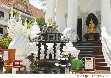 Buddha statue in Naga Prok position placed to decorate the front of the Church at Wat Nakprok temple in Bangkok capital city , Thailand. Buddha statue in Naga Prok position placed to decorate the front of the Church at Wat Nakprok temple in Bangkok capital city , Thailand. 121908700