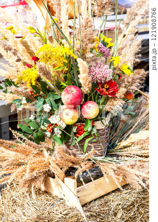 Colorful decorative composition of flowers, plants and apples 121908766