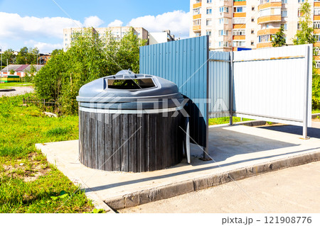 Modern round garbage container for household waste Modern round garbage container for household waste 121908776