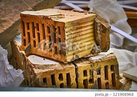 Red orange brick left after the destruction.After the disaster 121908968