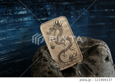 Pure silver bar with dragon. Business and finance. Pure silver bar with dragon. Business and finance. 121909137