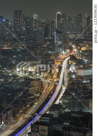 Night view of light trails of cars on the road of Bangkok city. Night view of light trails of cars on the road of Bangkok city. 121909630