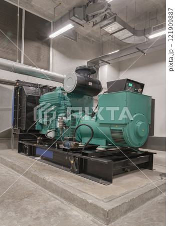 Electricity generation room with Engine generator set powered by Diesel power. 121909887