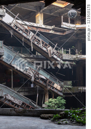 Dramatic view of Damaged escalators inside Abandoned new world shopping mall building. Dramatic view of Damaged escalators inside Abandoned new world shopping mall building. 121910178