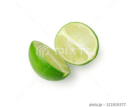 Squeezed lime isolated, squeezed out half green lemon on white background, burnout symbol 121910377