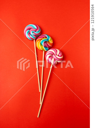 Color lollipop, spiral candy on stick, colorful striped lollypop, round fruit caramel, circle lollipop Color lollipop, spiral candy on stick, colorful striped lollypop, round fruit caramel, circle lollipop 121910564