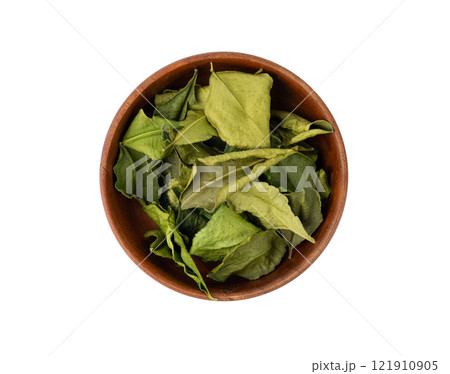 Thai lime dried leaves isolated, makrut lime or Citrus hystrix leaf pile, kaffir lime dry sprouts, Asia spices Thai lime dried leaves isolated, makrut lime or Citrus hystrix leaf pile, kaffir lime dry sprouts, Asia spices 121910905