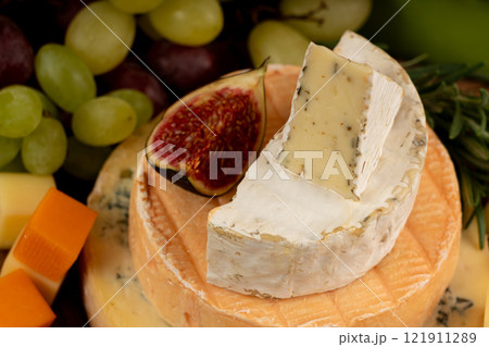 Cheese plate of color cheeses variety, yellow, white and blue cheese board, assorted dairy products Cheese plate of color cheeses variety, yellow, white and blue cheese board, assorted dairy products 121911289