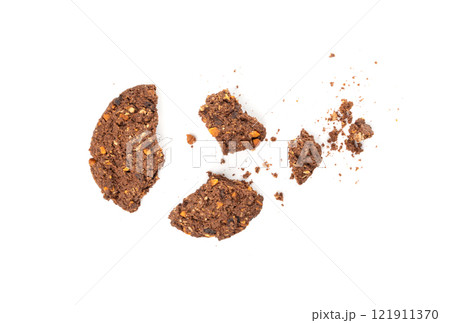 Crumbled chocolate oatmeal cookies isolated, broken cereal oat crackers with nuts 121911370
