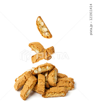 Falling biscotti di prato isolated on white background. Flying italian cantuccini nuts cookies Falling biscotti di prato isolated on white background. Flying italian cantuccini nuts cookies 121911414