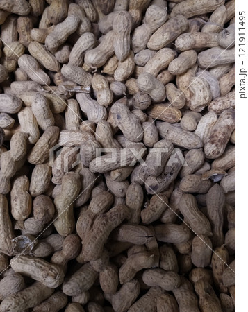 A lot of peanuts in the shell 121911495